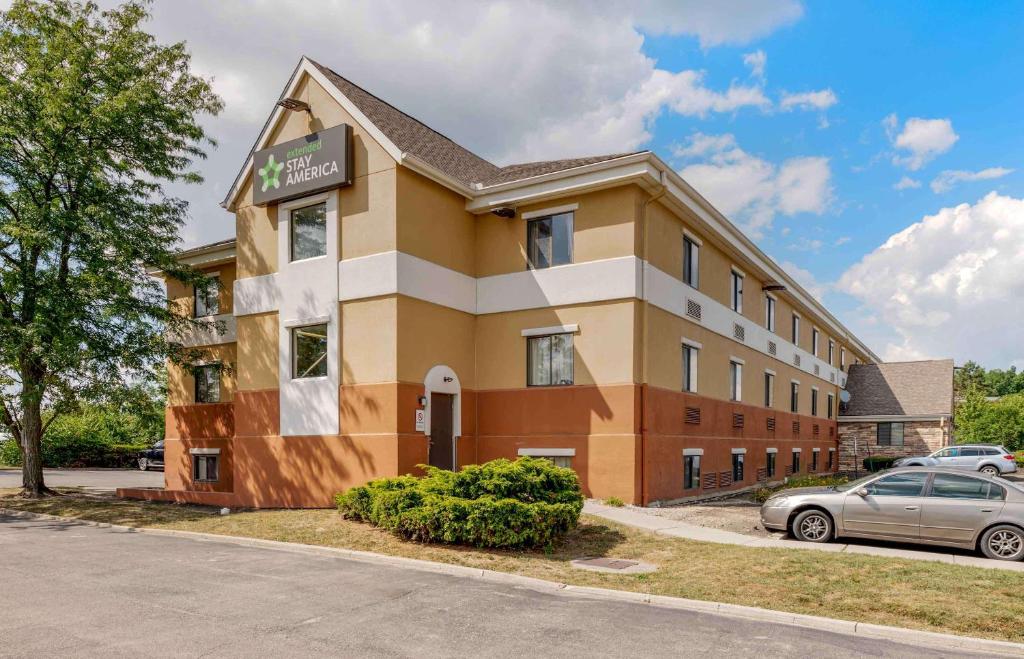 a building with a car parked in front of it at Extended Stay America Suites - Dayton - South in Dayton