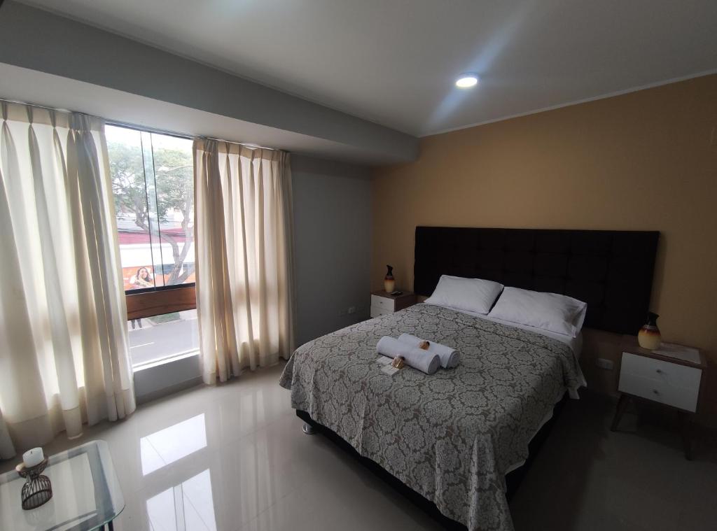 Postel nebo postele na pokoji v ubytování Inti Llaqta Hotel & Suites