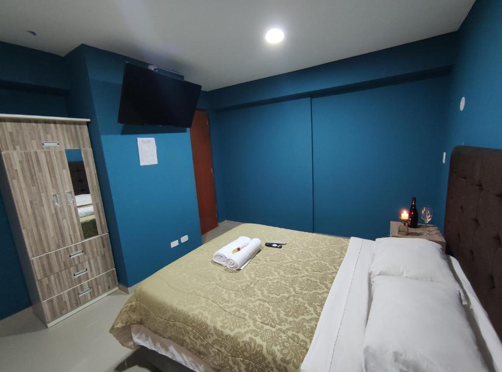 Postel nebo postele na pokoji v ubytování Inti Llaqta Hotel & Suites