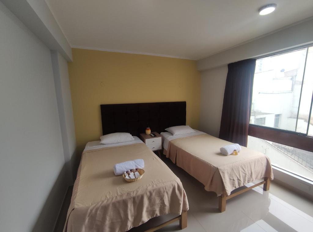 Postel nebo postele na pokoji v ubytování Inti Llaqta Hotel & Suites