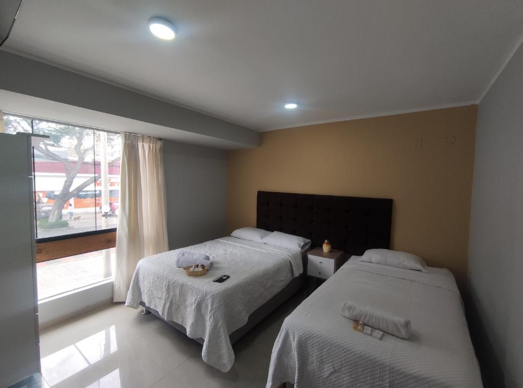 Postel nebo postele na pokoji v ubytování Inti Llaqta Hotel & Suites