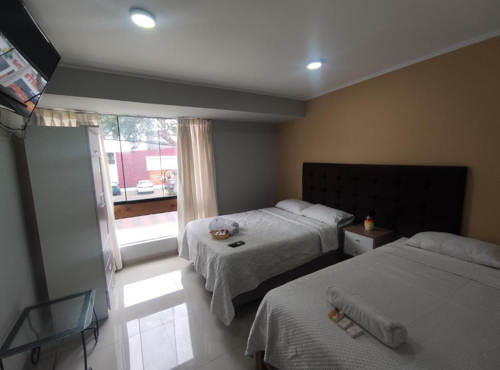 Postel nebo postele na pokoji v ubytování Inti Llaqta Hotel & Suites