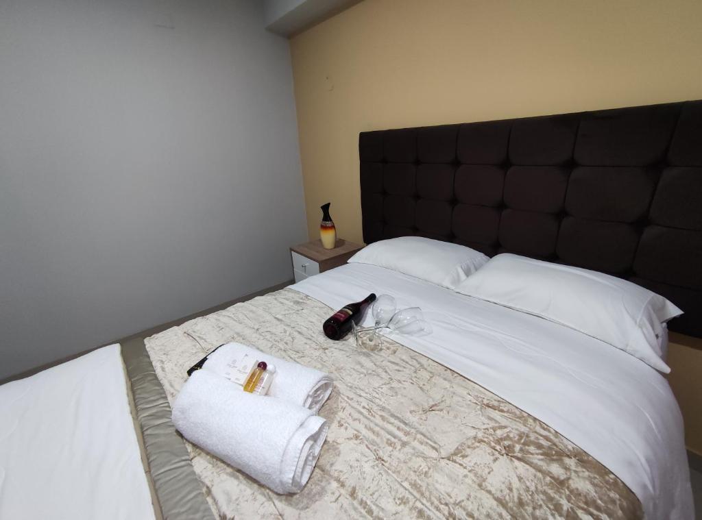 Postel nebo postele na pokoji v ubytování Inti Llaqta Hotel & Suites