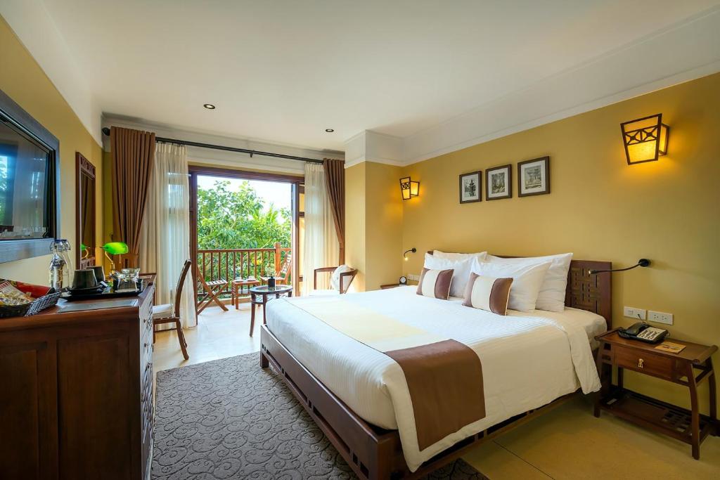 Postel nebo postele na pokoji v ubytování La Siesta Hoi An Resort & Spa