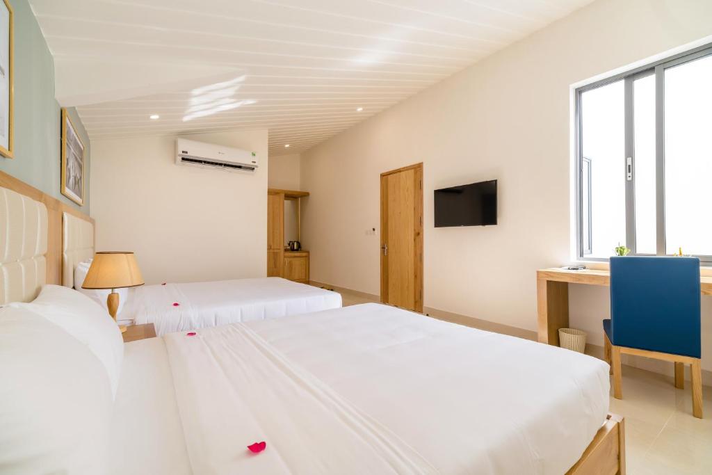 Babylon Hoi An Central Villa - 阳台的家庭房