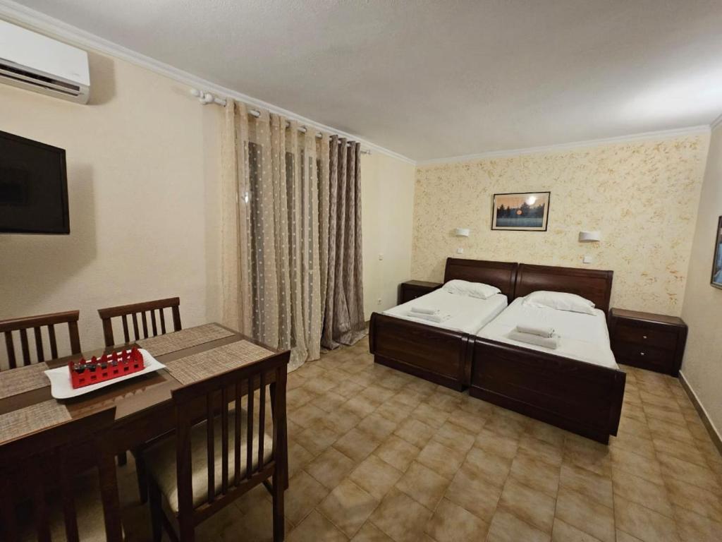 Łóżko lub łóżka w pokoju w obiekcie Corfu Glyfada Apartment 45
