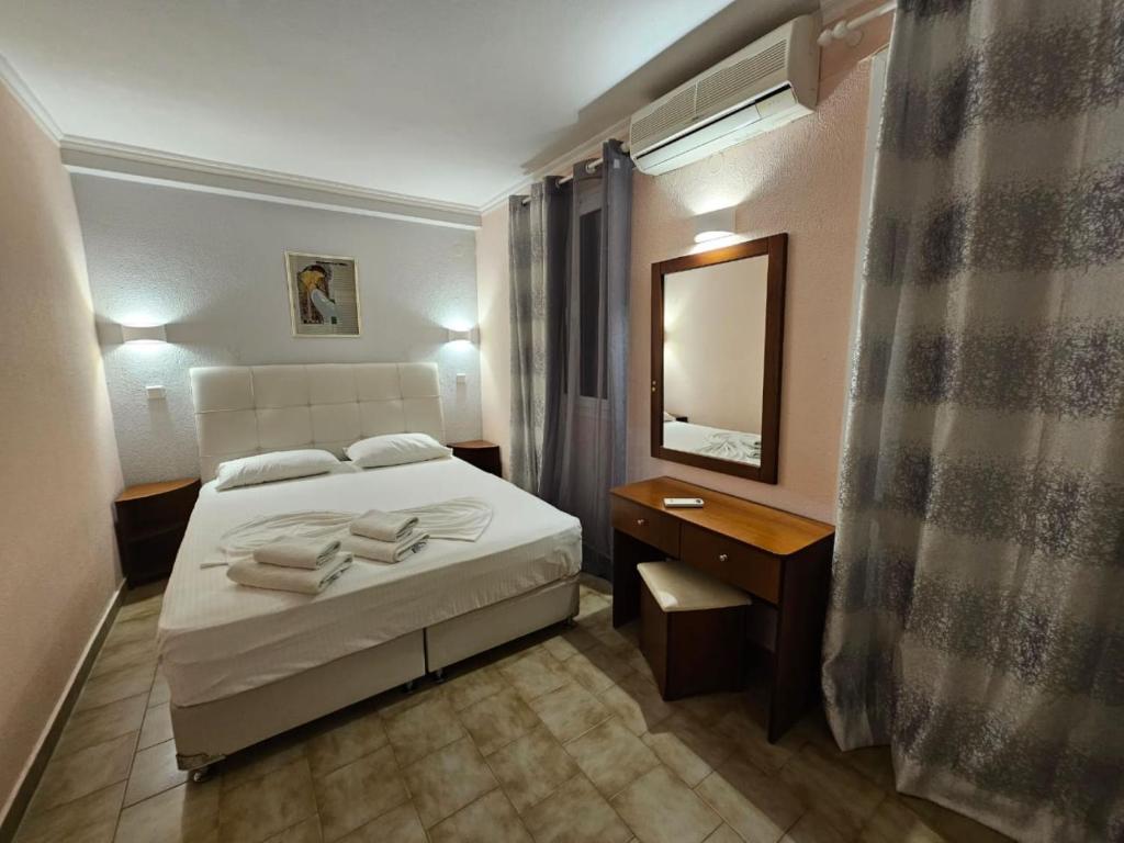 Łóżko lub łóżka w pokoju w obiekcie Corfu Glyfada Apartment 45