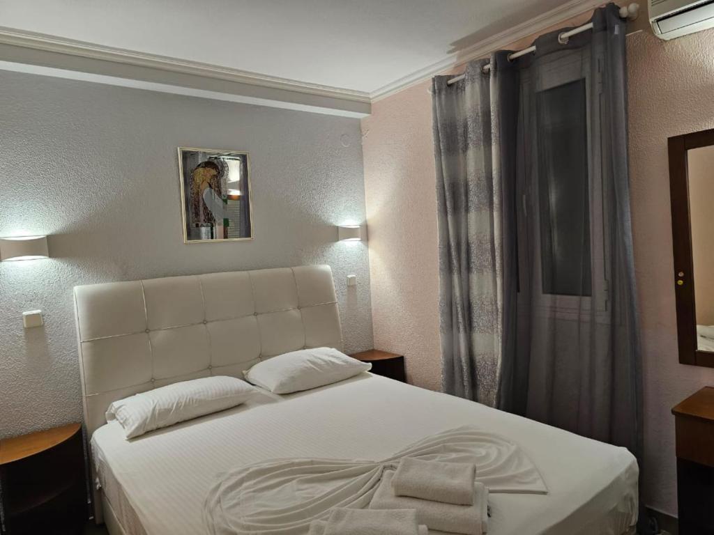 Łóżko lub łóżka w pokoju w obiekcie Corfu Glyfada Apartment 45