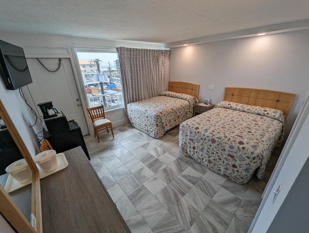 Postel nebo postele na pokoji v ubytování Admiral Resort Motel