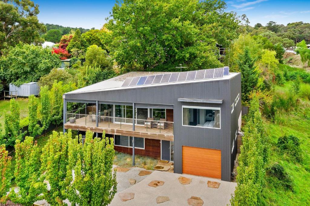 an aerial view of a house with solar panels on its roof at Bilsons Landing East in Daylesford