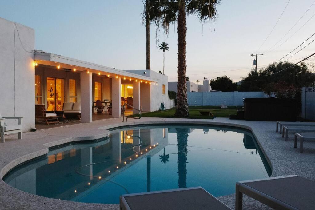 a swimming pool in front of a house at Moon Valley Treasure - Chef's Kitchen l Pool l Spa in Phoenix