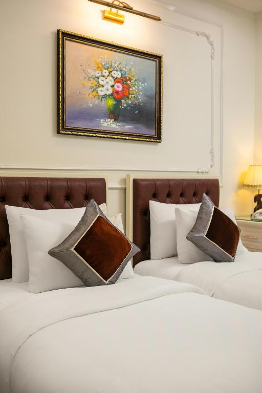 Postel nebo postele na pokoji v ubytování Tunger Grand Hotel