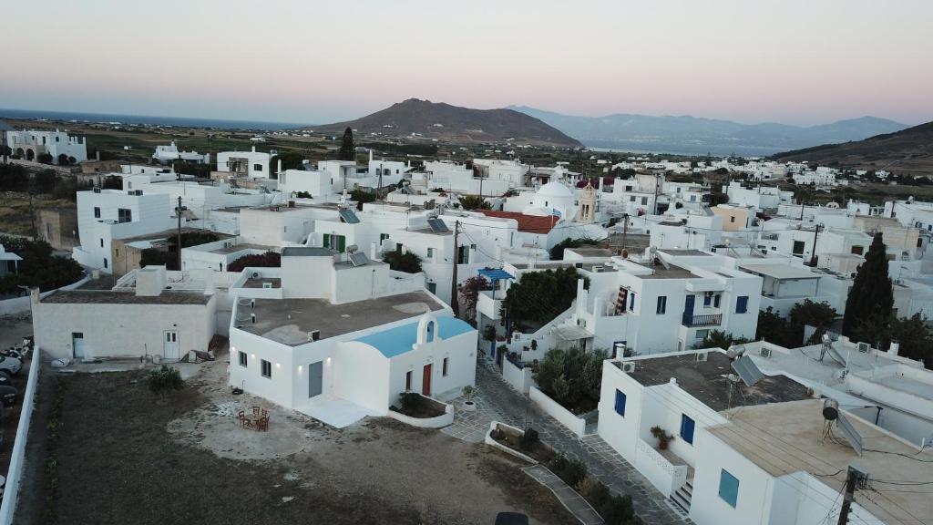 an aerial view of a town with white buildings at Saint Barbara luxury home in Dhragoulás