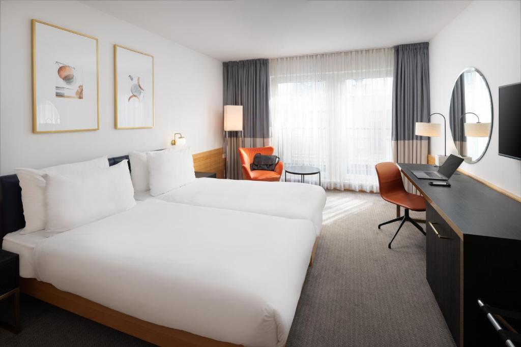 Postel nebo postele na pokoji v ubytování K+K Hotel Opera