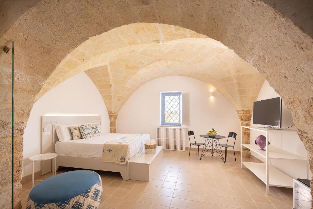 Postel nebo postele na pokoji v ubytování Masseria Malvindi