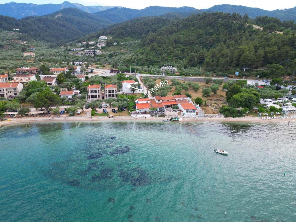 an aerial view of a beach with a town at CeraMio Suites in Limenas