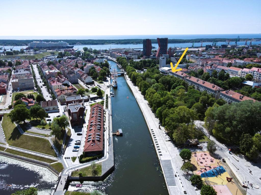 an aerial view of a city with a river at Great View Meridianas Apartment in Klaipėda