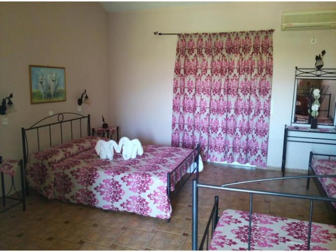 Voodi või voodid majutusasutuse Hotel Takis toas