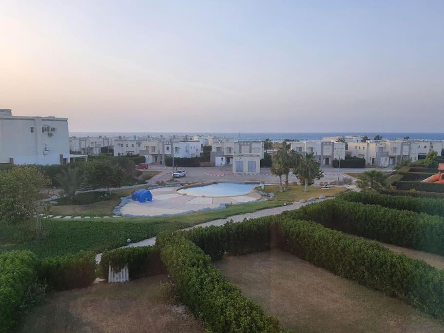 The swimming pool at or close to Chalet in Amwaj with a Sea view