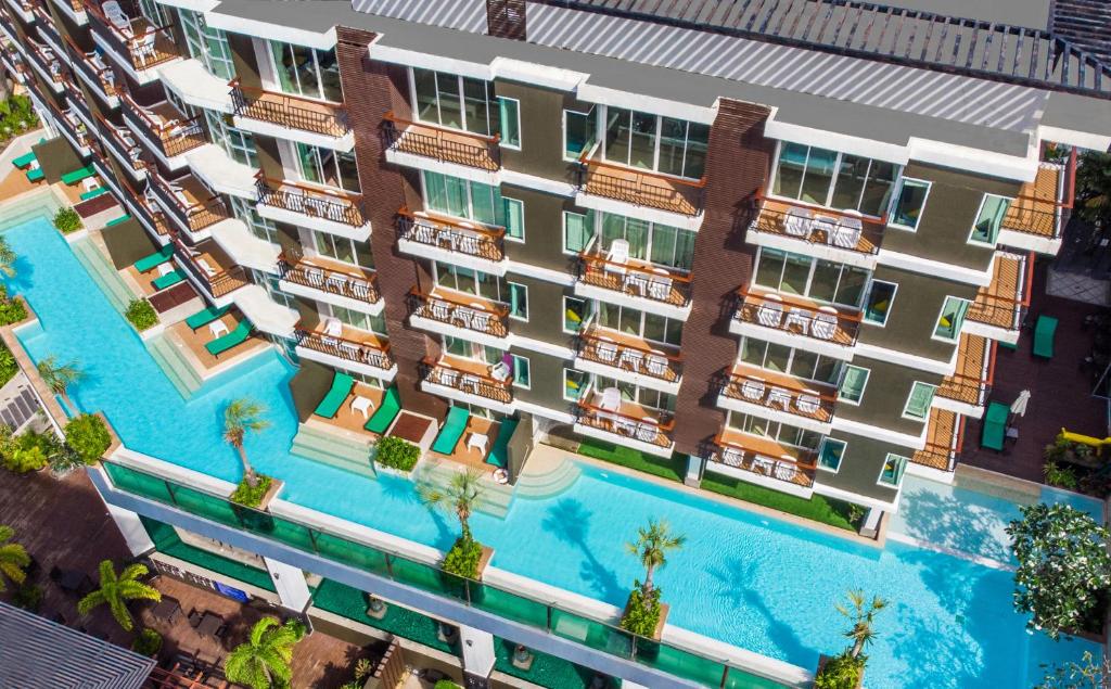 an overhead rendering of an apartment building with a swimming pool at Andakira Hotel - SHA Extra Plus in Patong Beach