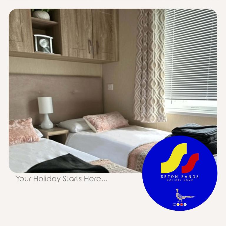 Rúm í herbergi á Seton Sands Holiday Home