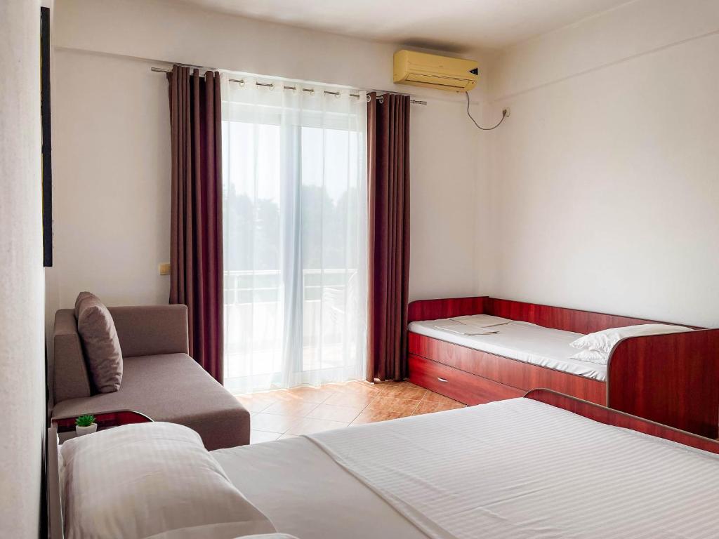Postel nebo postele na pokoji v ubytování Villa Antonio