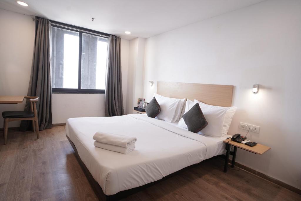 Postel nebo postele na pokoji v ubytování Hotel Sunflare