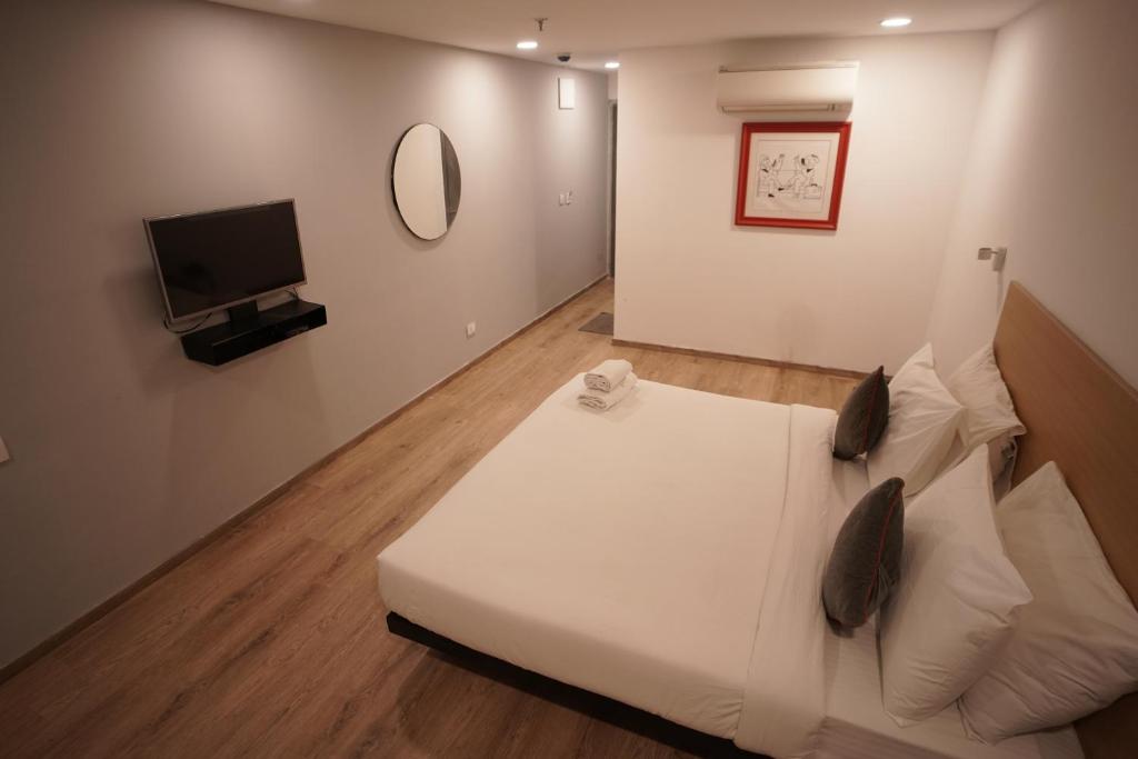 Postel nebo postele na pokoji v ubytování Hotel Sunflare