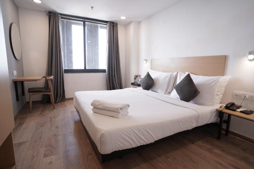 Postel nebo postele na pokoji v ubytování Hotel Sunflare