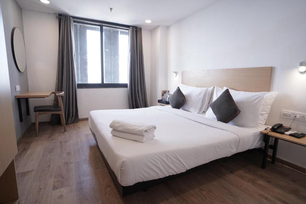 Postel nebo postele na pokoji v ubytování Hotel Sunflare