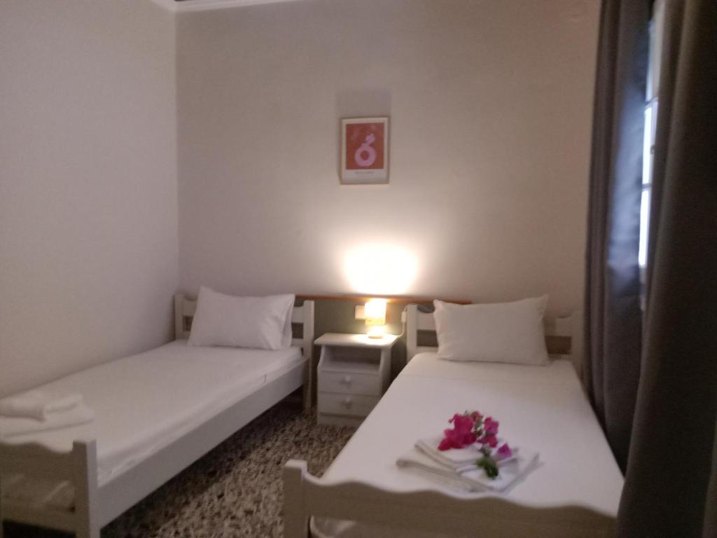 Postel nebo postele na pokoji v ubytování Menegis Apartment