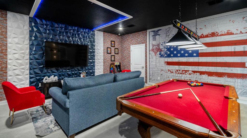 a living room with a pool table and a couch at 1249 Challenge in Davenport