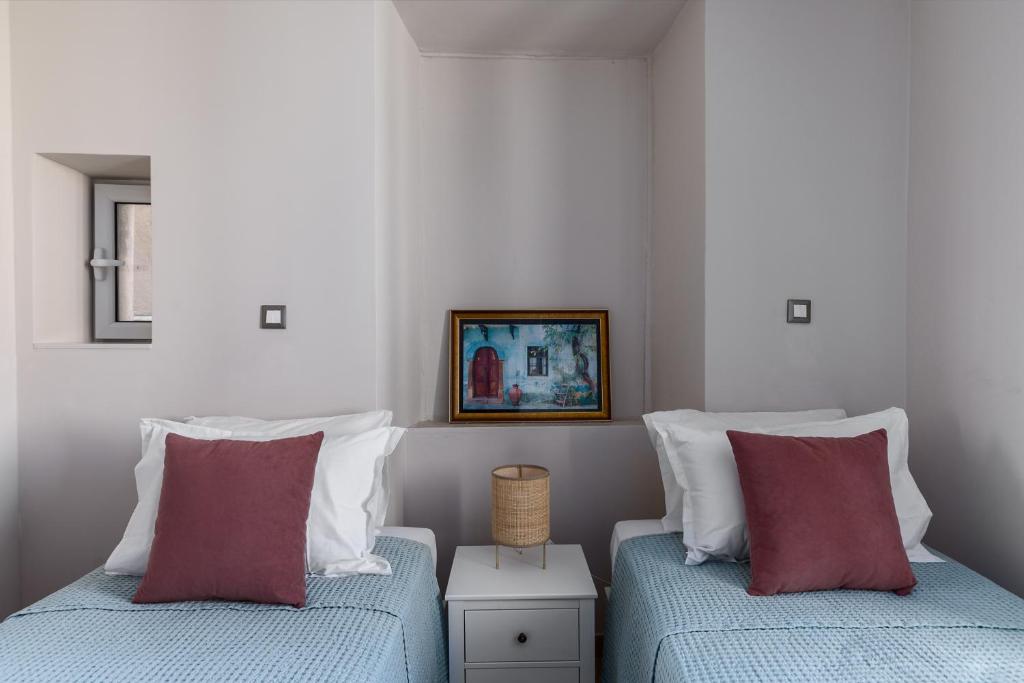 Postel nebo postele na pokoji v ubytování Fotiadis Family Luxury Suites by Konnect