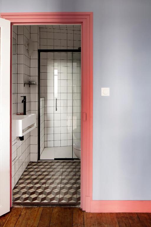 a bathroom with a toilet and a sink at Au Petit Thouars in Thouars