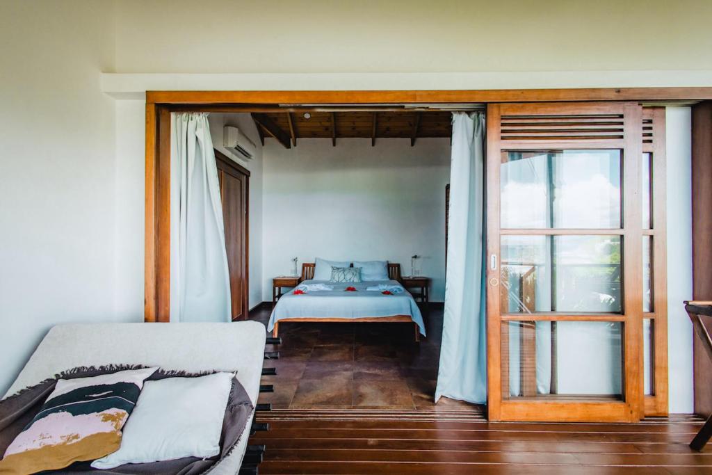 Postel nebo postele na pokoji v ubytování Villas de Jardin self-catering