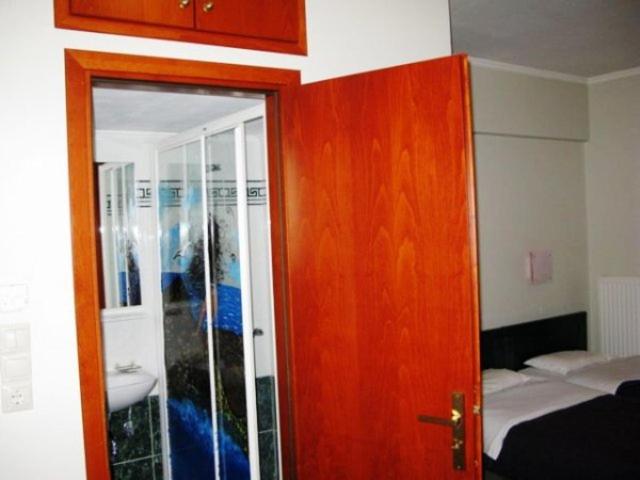 Postel nebo postele na pokoji v ubytování ALEXANDER Rooms