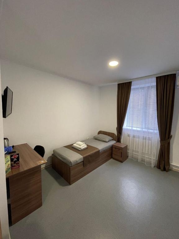 Postel nebo postele na pokoji v ubytování Apec Hotel