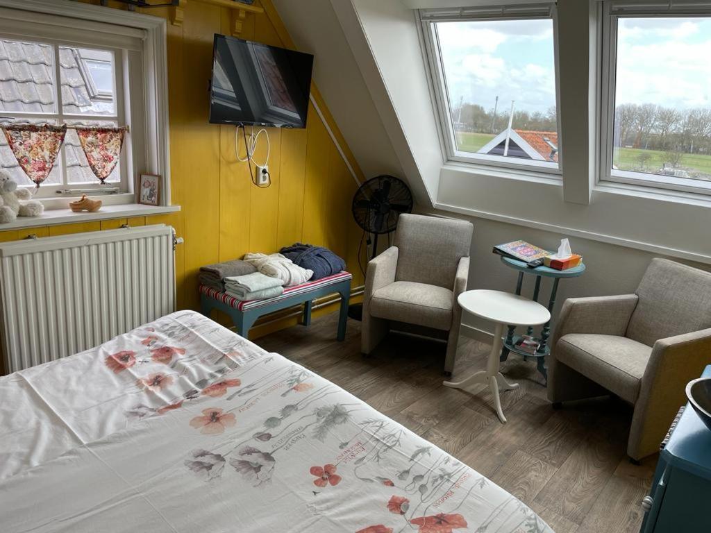 Postel nebo postele na pokoji v ubytování Bed and Breakfast De Pepersteeg