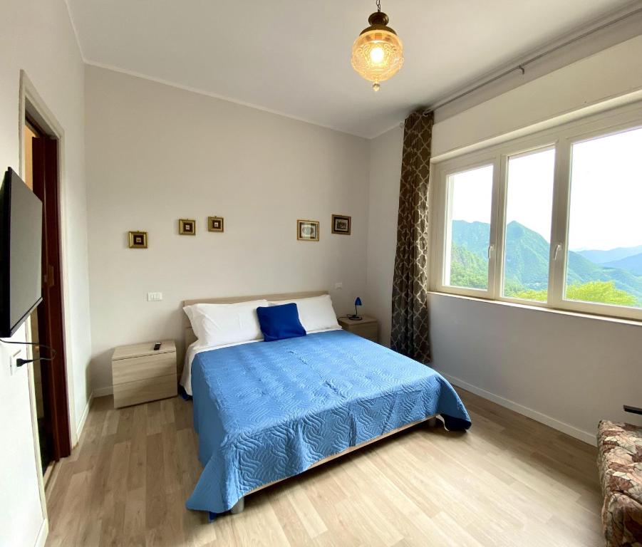 Postel nebo postele na pokoji v ubytování Albergo Lodrino