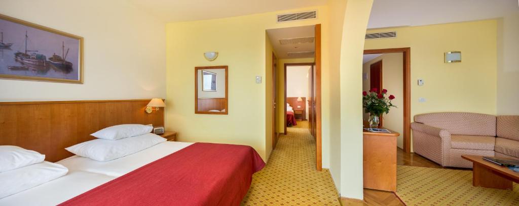 Postel nebo postele na pokoji v ubytování Hotel Zora