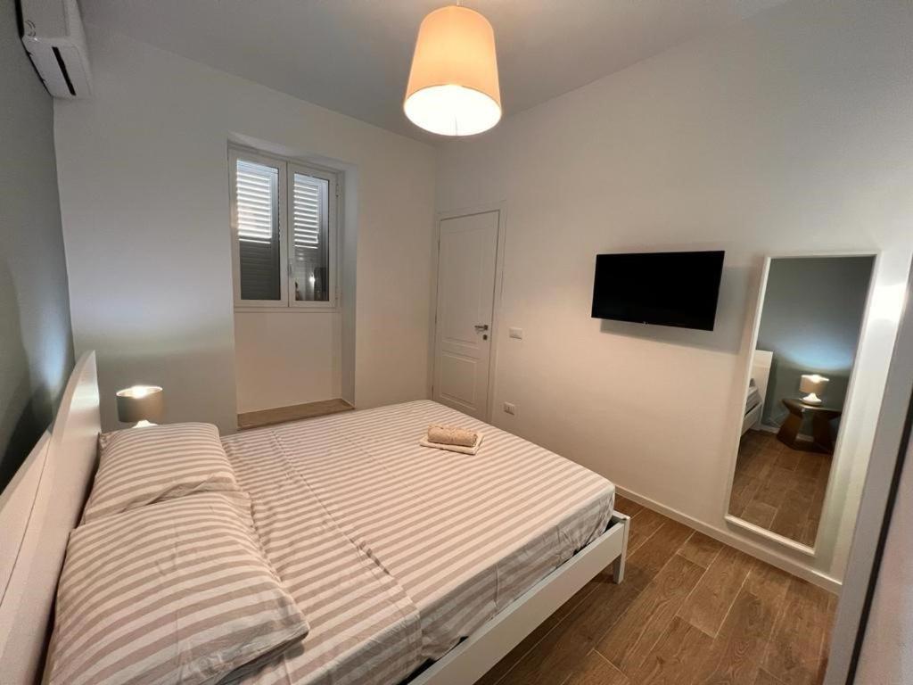 מיטה או מיטות בחדר ב-La casa di Detta (Le Scaramazze)