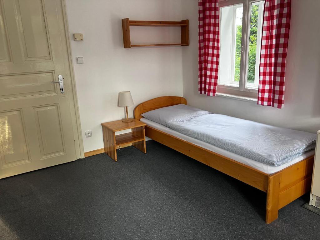 Postel nebo postele na pokoji v ubytování Penzion Hají