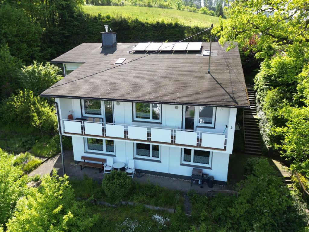 an aerial view of a house with a roof at Rothaarsteig Ferienhaus in Kirchhundem