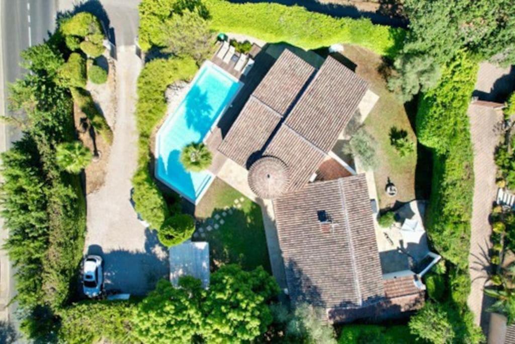 an aerial view of a house with a swimming pool at Central Valbonne Villa in Valbonne