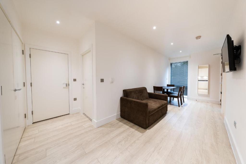 a living room with a couch and a table at Stylish 2 bedroom Apartment in Central london in London