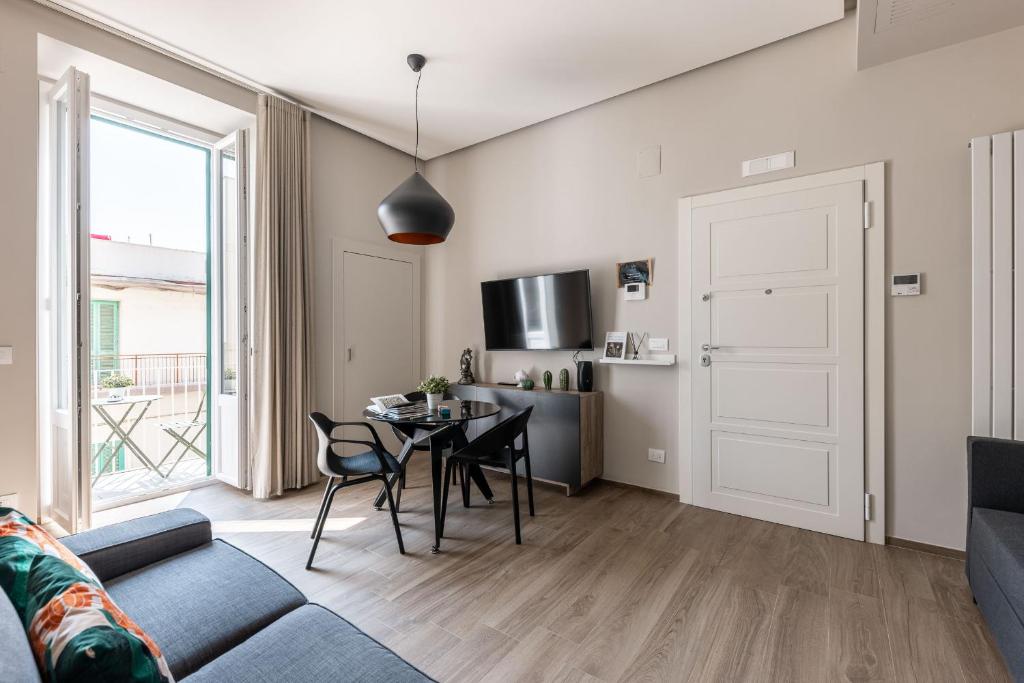 Televízia a/alebo spoločenská miestnosť v ubytovaní Apartment Natale