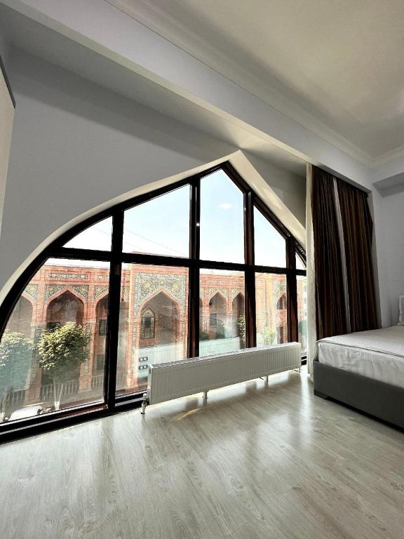 Llit o llits en una habitació de Viva Hotel