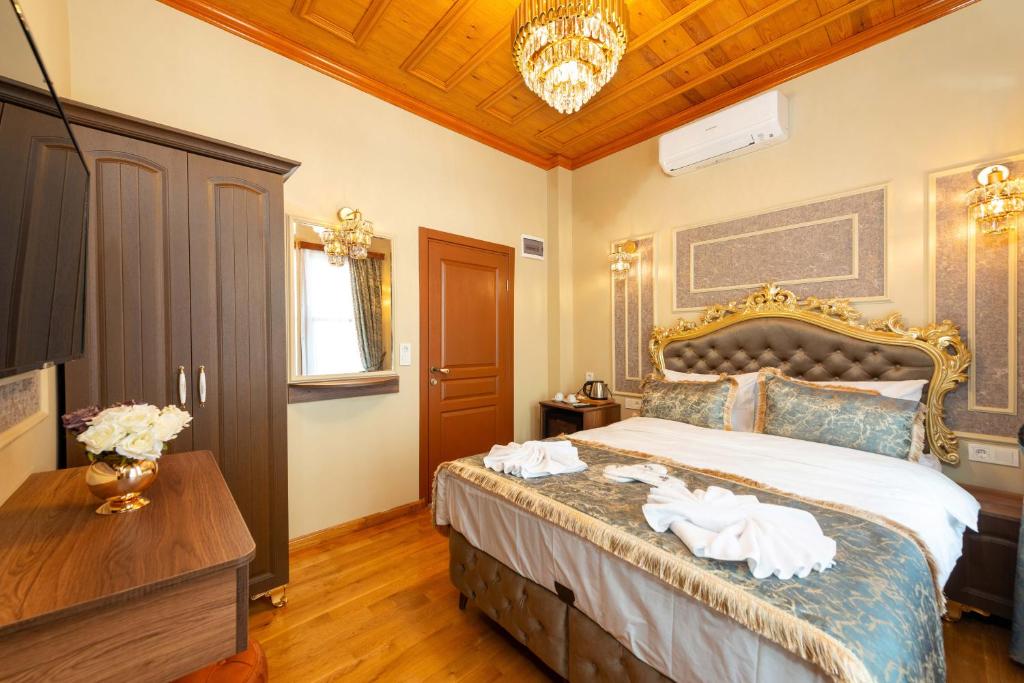 Postel nebo postele na pokoji v ubytování Brown Mansion Oldcity