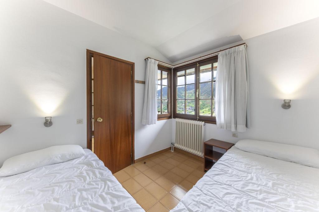 Postel nebo postele na pokoji v ubytování La Solana Apartaments & Spa