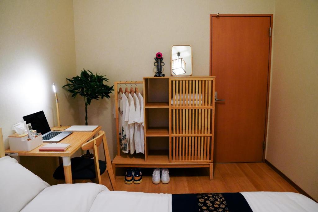 Postel nebo postele na pokoji v ubytování E JOY INN-West Shinjuku Branch